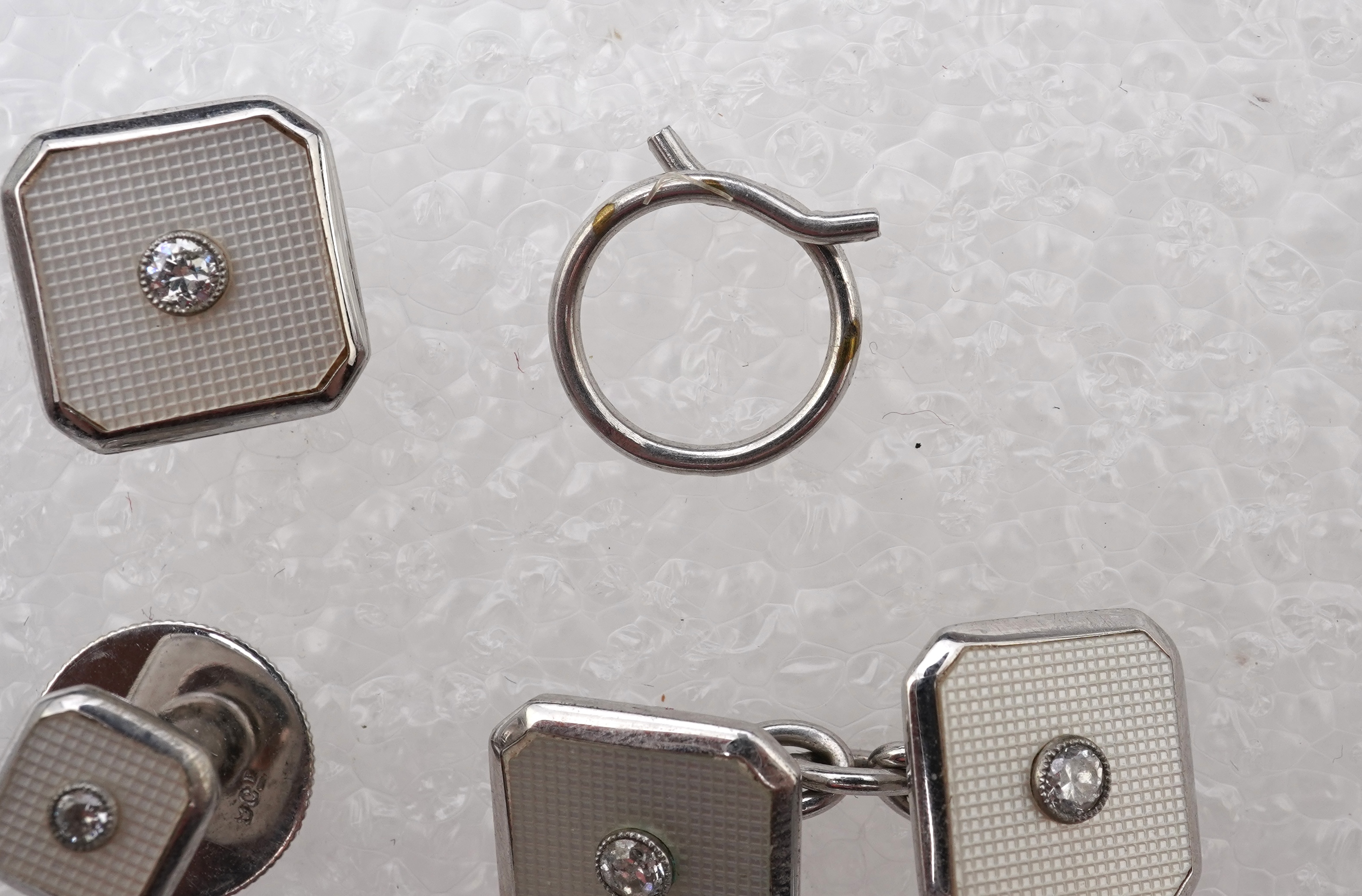 An Art Deco mother of pearl and diamond dress set, circa 1930